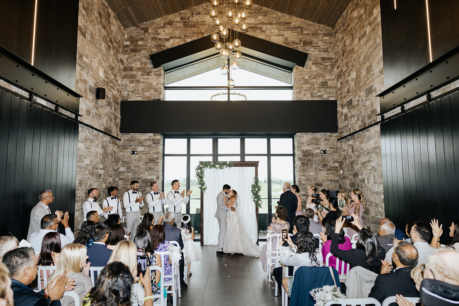 Couple gets married at indoor ceremony at Mickelson National Golf Course Wedding venue